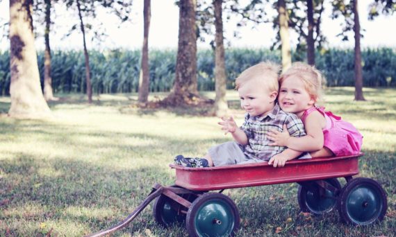 2 toddlers in a wagon